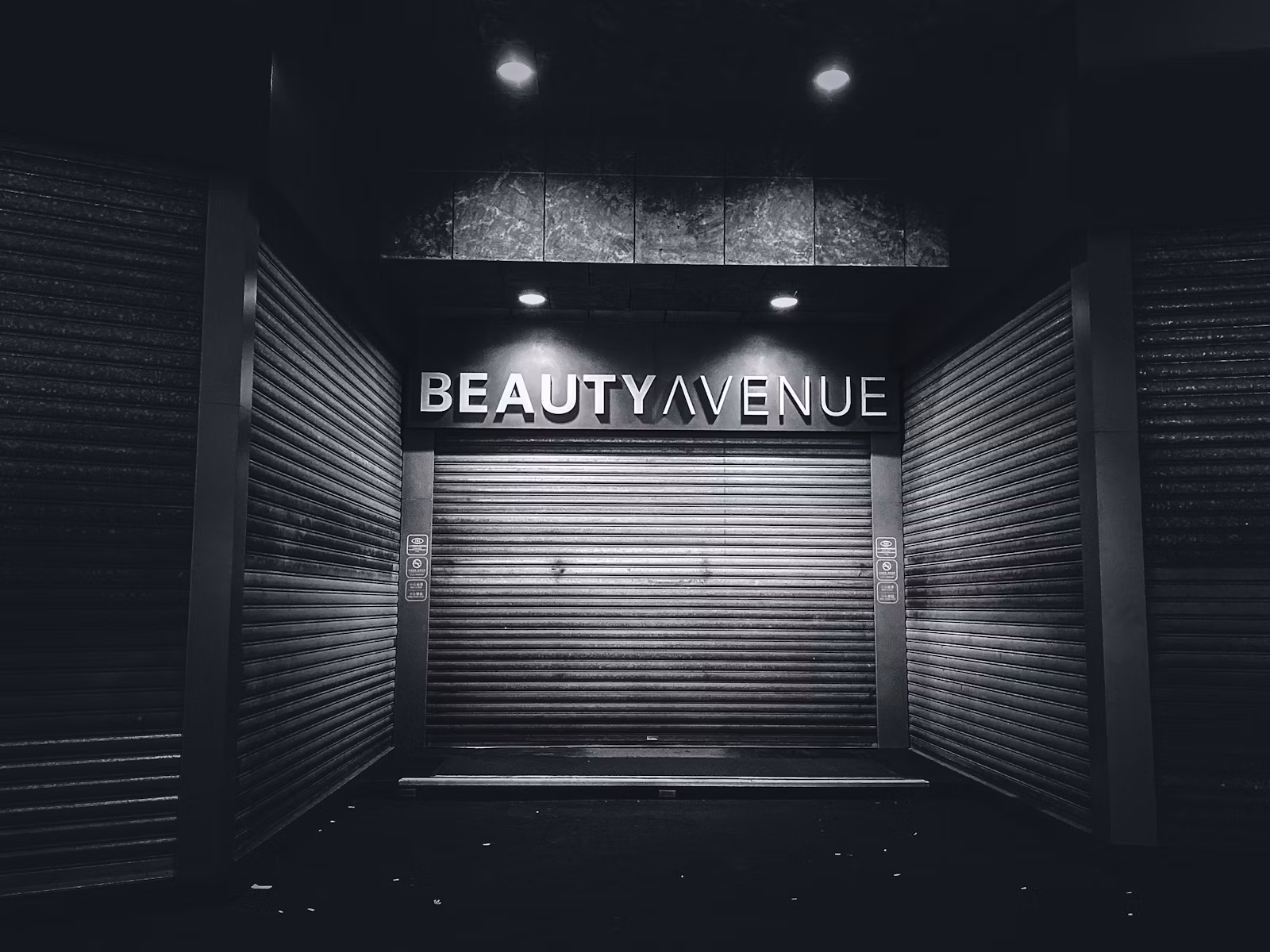 a black and white photo of a closed storage unit